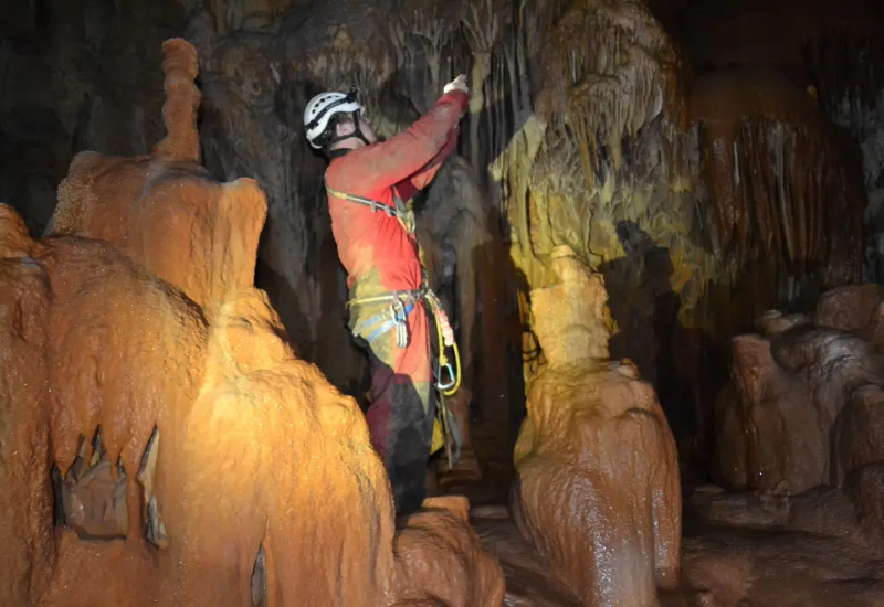 Cave discovered spanning into Italy